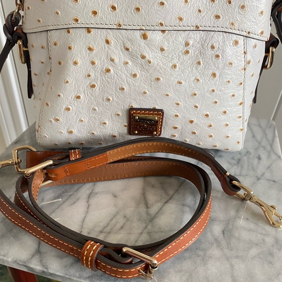 Dooney & Bourke White Ostrich Leather purse.
Brand new condition only used once. - Picture 9 of 11